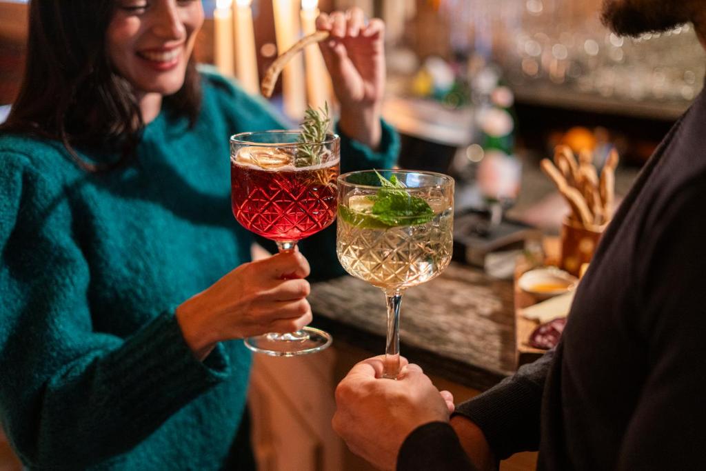 a group of people holding glasses of wine at La Genzianella Bormio in Bormio