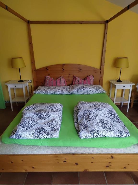 a bedroom with a bed with two pillows on it at LA CASA AL BREMBO b&b in Paladina