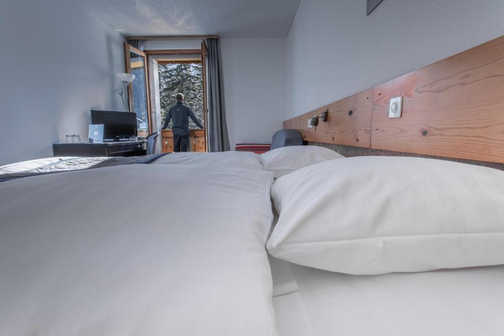 Postel nebo postele na pokoji v ubytování Hôtel Les Sources