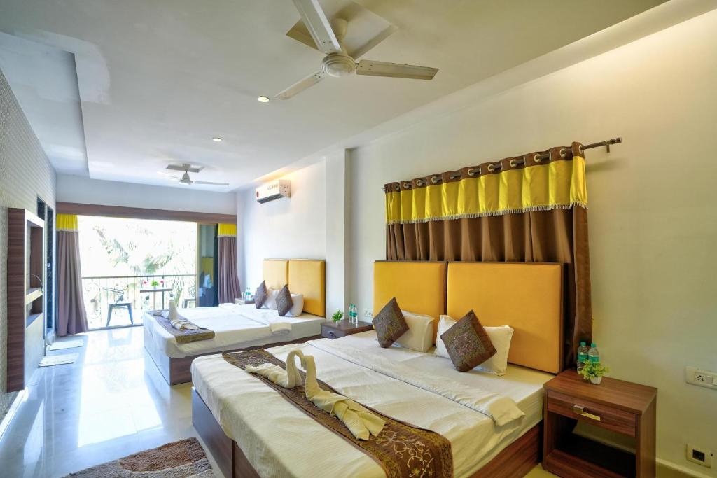 Ένα ή περισσότερα κρεβάτια σε δωμάτιο στο Hotel Mild Inn