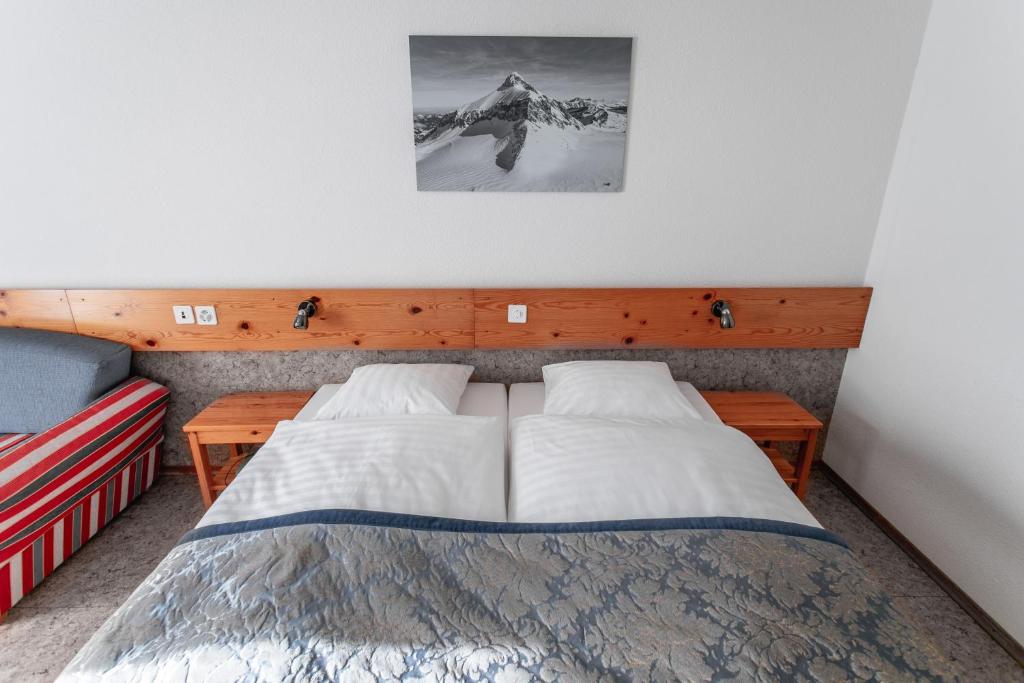 Postel nebo postele na pokoji v ubytování Hôtel Les Sources
