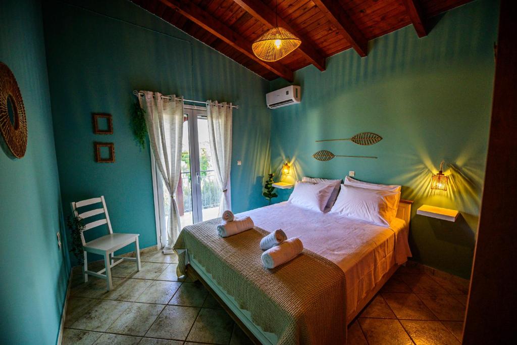 a bedroom with a bed with two teddy bears on it at NoamansHouse SeaView near Airport in Artemida