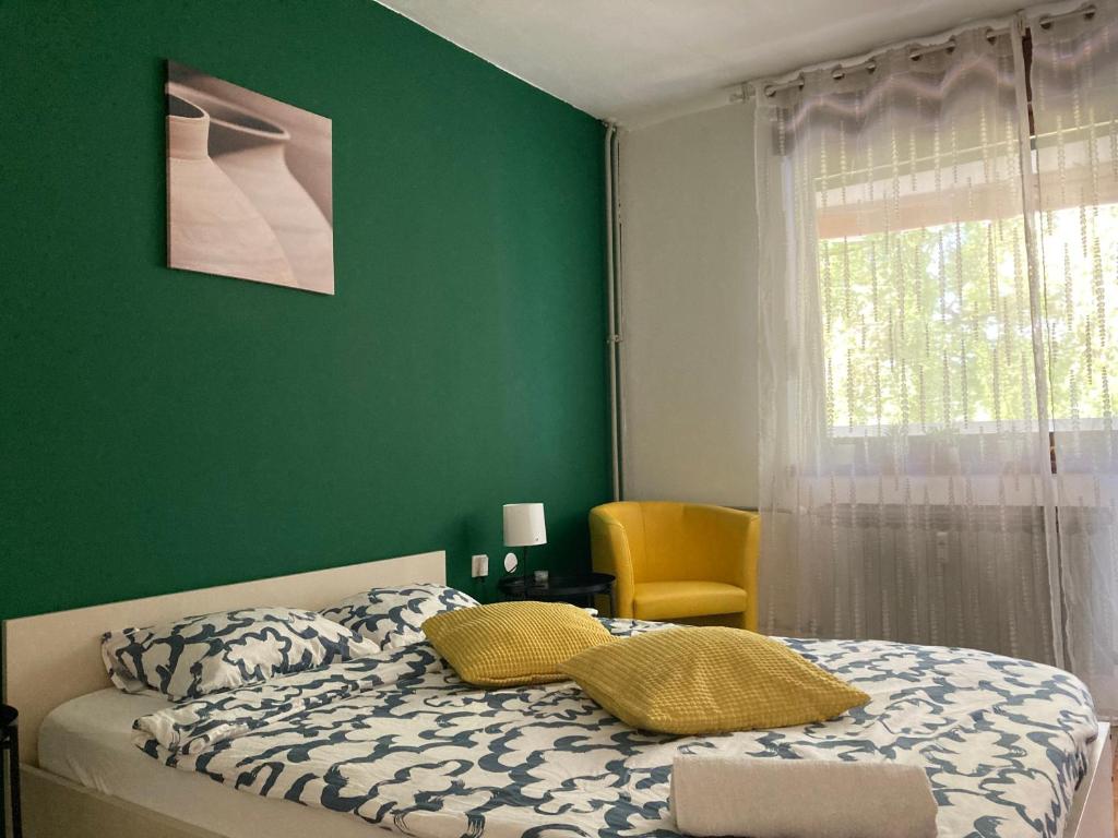 a green bedroom with a bed and a window at STUDIO APP STELLA Jarun Zagreb SELF-CHECK-IN in Zagreb