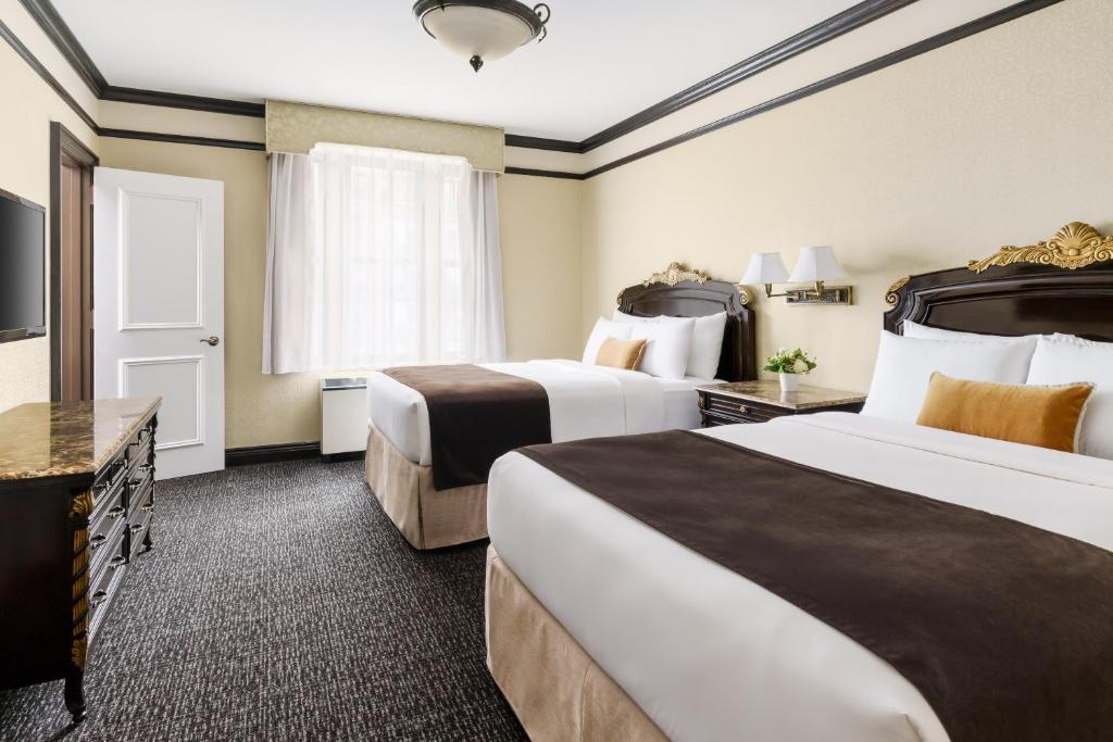 Postel nebo postele na pokoji v ubytování Hotel Lucerne