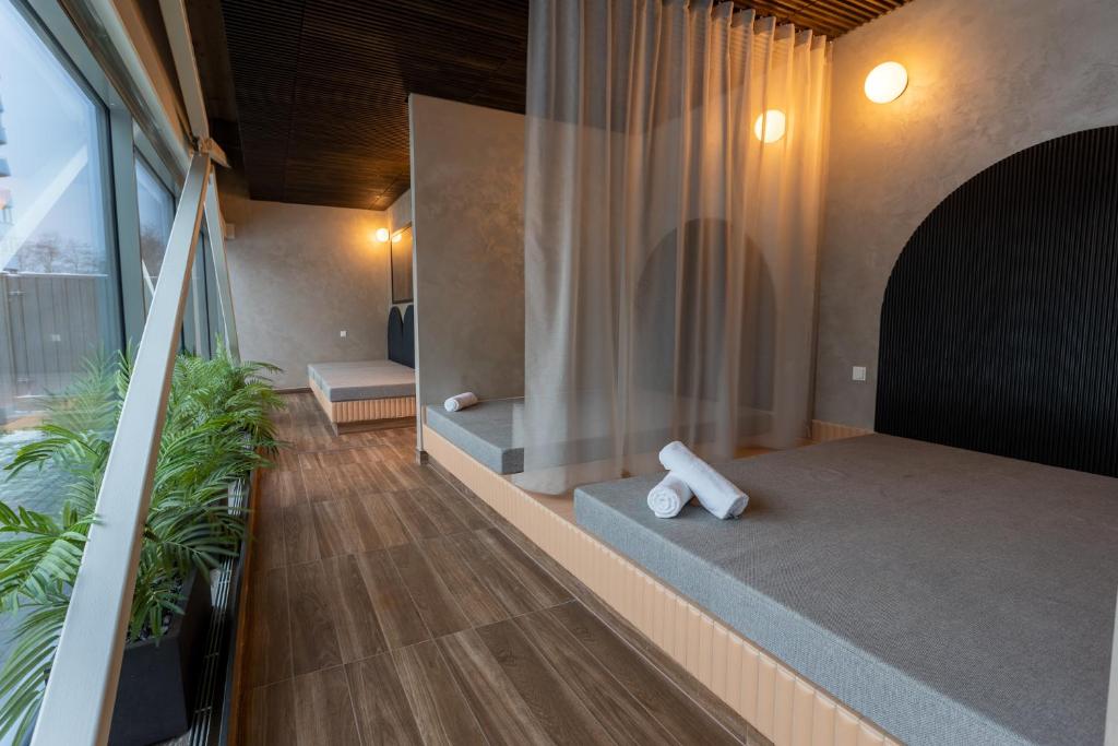 Postel nebo postele na pokoji v ubytování Ring SPA Hostel