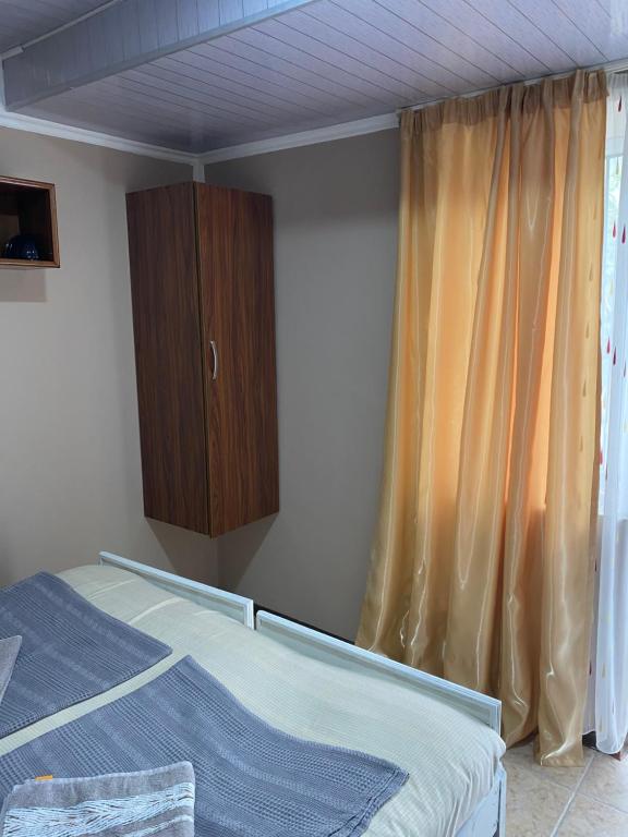 Postel nebo postele na pokoji v ubytování Vakho house