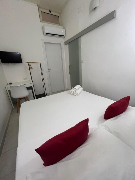Łóżko lub łóżka w pokoju w obiekcie B&B Regina Rooms