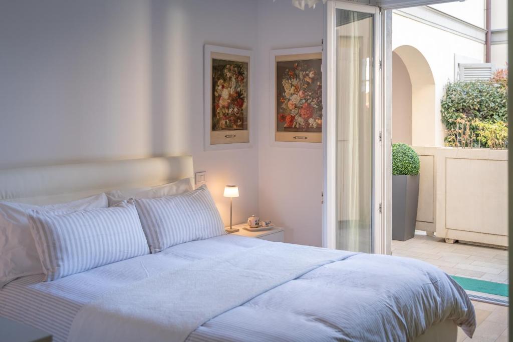 Ένα ή περισσότερα κρεβάτια σε δωμάτιο στο Bambagioni 14 - Smart Flat con Garage Privato - ItalyWeGo