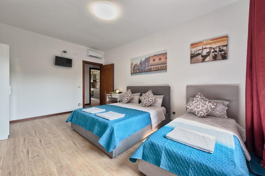 Postel nebo postele na pokoji v ubytování Bellavista Palladio Apartment