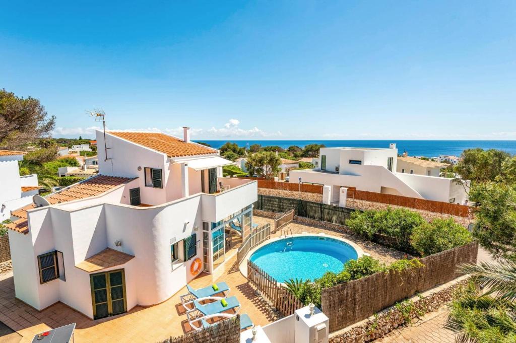 an image of a villa with a swimming pool at Villa Bini Mestral by Villa Plus in Binibeca