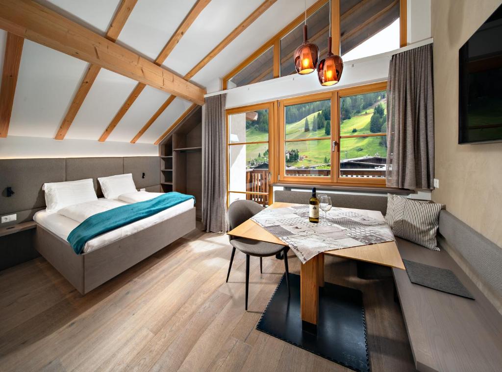 Postel nebo postele na pokoji v ubytování Villa David Dolomites