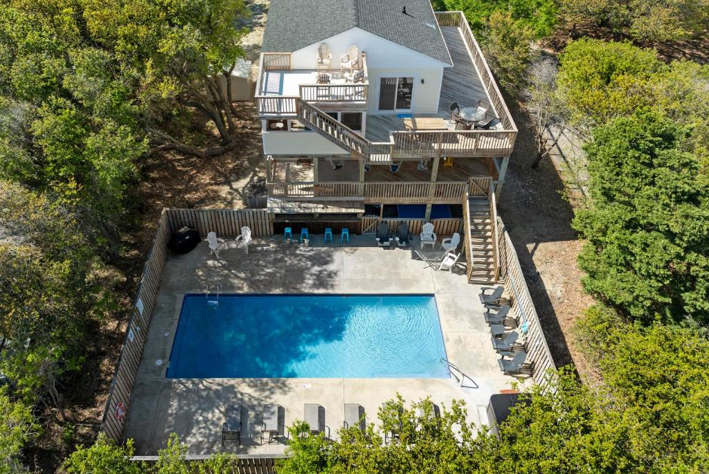 an overhead view of a house with a swimming pool at Aloha Shores in Southern Shores