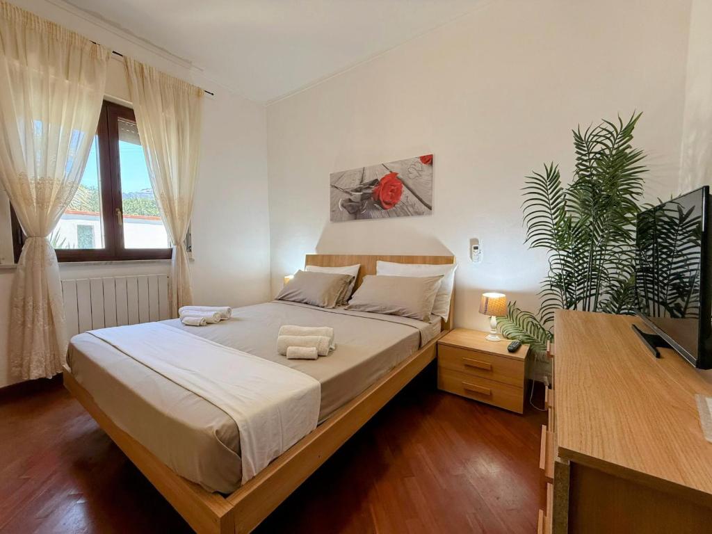 Postel nebo postele na pokoji v ubytování Casa vacanze Ciachea Home - Villa Accogliente con BBQ, Giardino e Parcheggio , A due Passi Da Palermo & Aereoporto