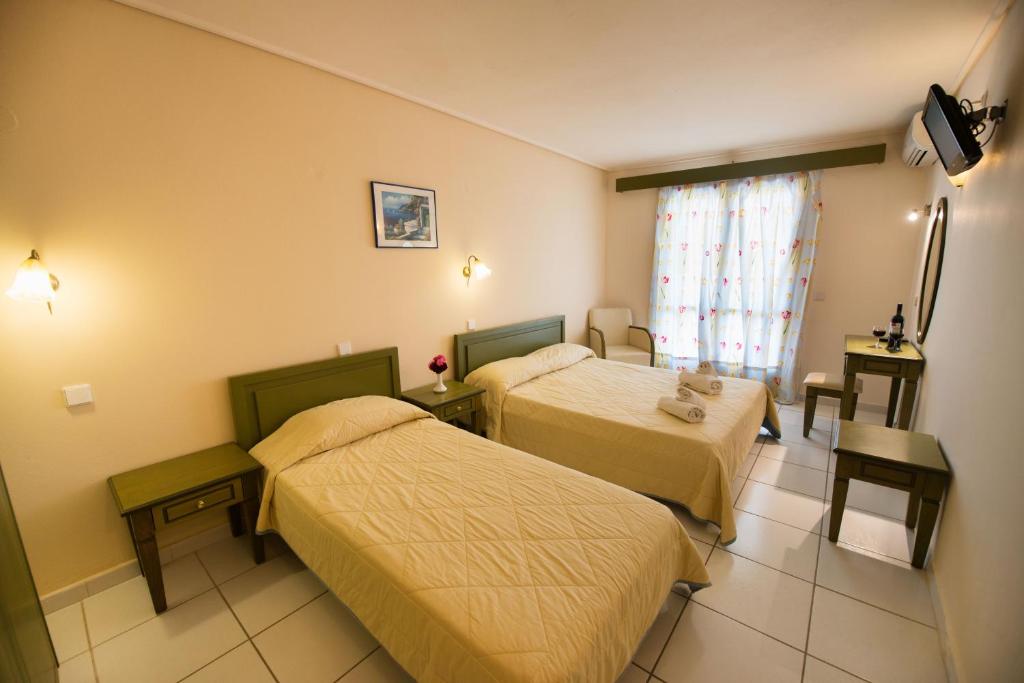 Postel nebo postele na pokoji v ubytování Hotel Niras