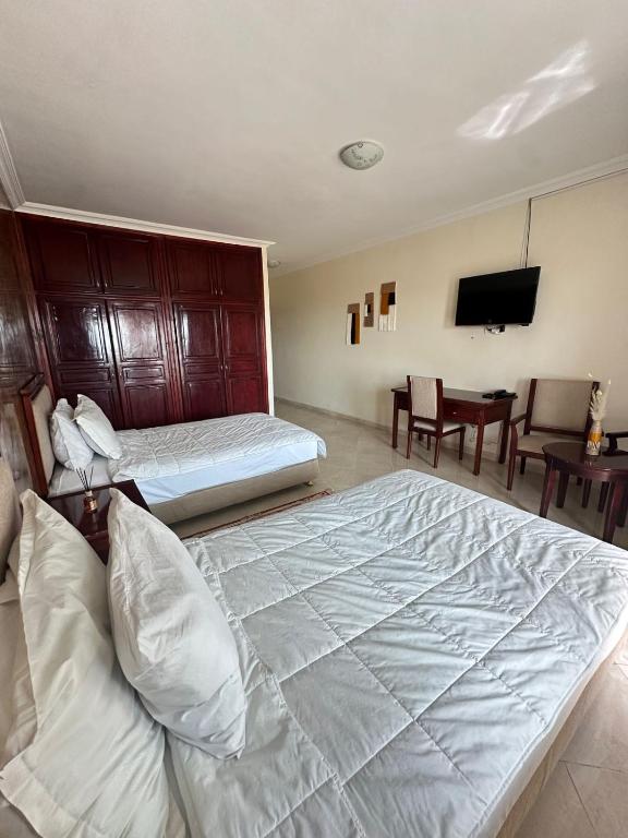 Postel nebo postele na pokoji v ubytování Hotel Angle Atlas & Spa