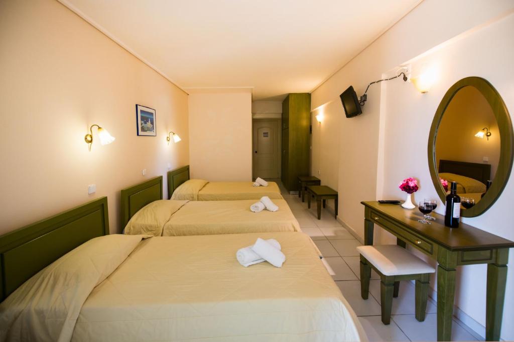 Postel nebo postele na pokoji v ubytování Hotel Niras