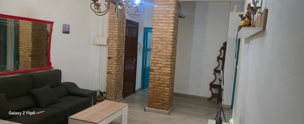 a living room with a couch and a table at Relax y bienestar in Valencia