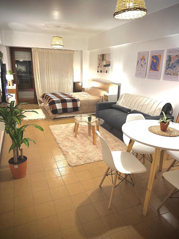 a living room with a couch and a table at Marcelinos la perla in Mar del Plata