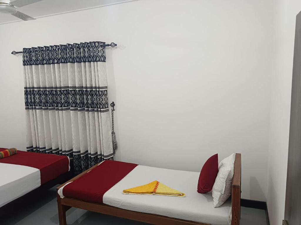 Postel nebo postele na pokoji v ubytování Suman Beach Rooms