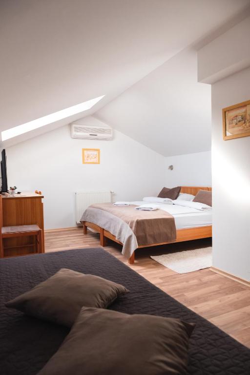 Postel nebo postele na pokoji v ubytování Garni Hotel Keltika