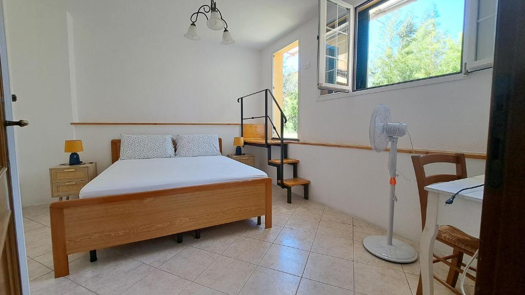 a bedroom with a bed and a window at Marianna Home and Parking in Monterosso al Mare