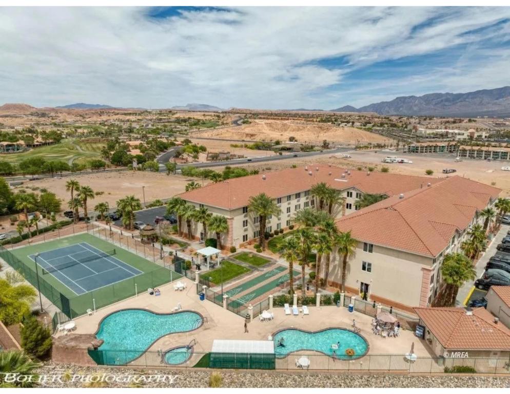an aerial view of a resort with a tennis court at Highland Estates Condotel in Mesquite
