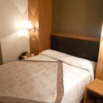 Postel nebo postele na pokoji v ubytování Alti Hôtel