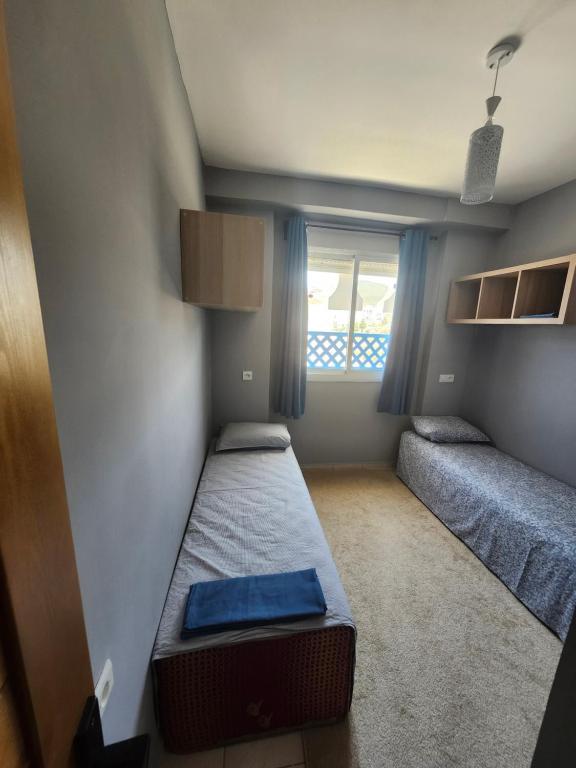 Postel nebo postele na pokoji v ubytování Appartement bien équipé à 5 min de la plage, TOUT INCLU!