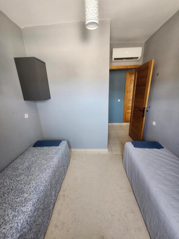Postel nebo postele na pokoji v ubytování Appartement bien équipé à 5 min de la plage, TOUT INCLU!