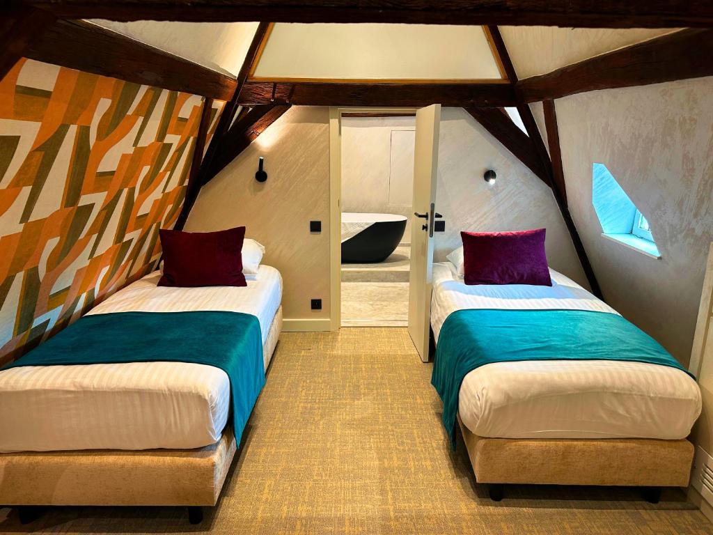 Postel nebo postele na pokoji v ubytování Van Der Valk Sélys Liège Hotel & Spa