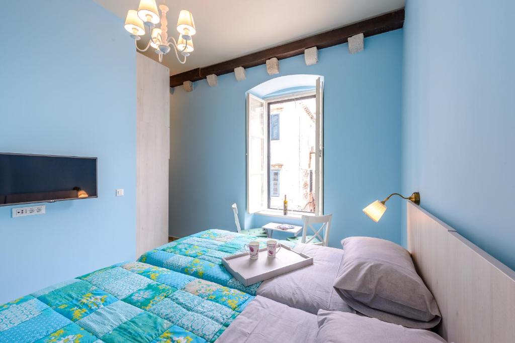 Postel nebo postele na pokoji v ubytování Stradun View En Suite Rooms & Studio