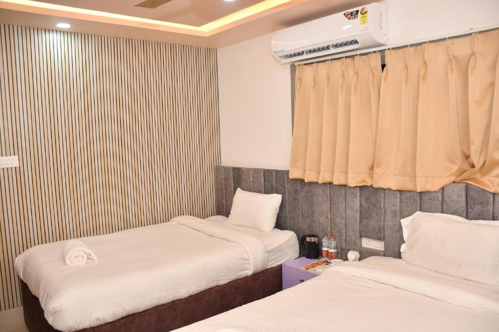 Postel nebo postele na pokoji v ubytování Hotel Ratneswar