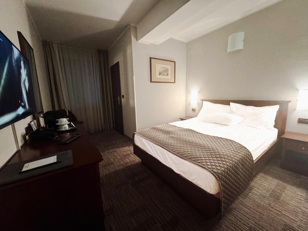 Postel nebo postele na pokoji v ubytování Hotel Marina