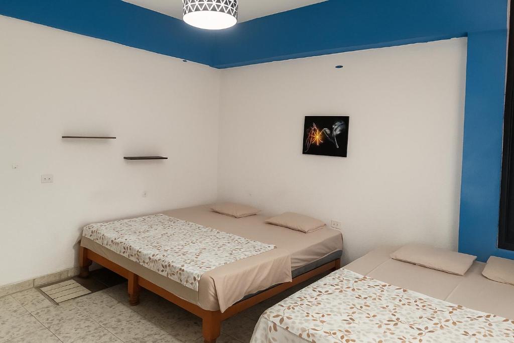 Postel nebo postele na pokoji v ubytování Hospedaje Casa Velaz