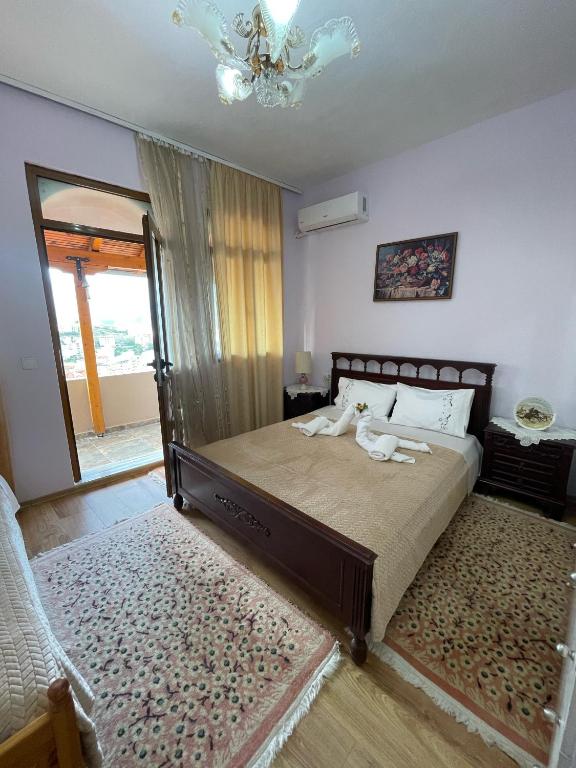 Postel nebo postele na pokoji v ubytování Luigi Guest House