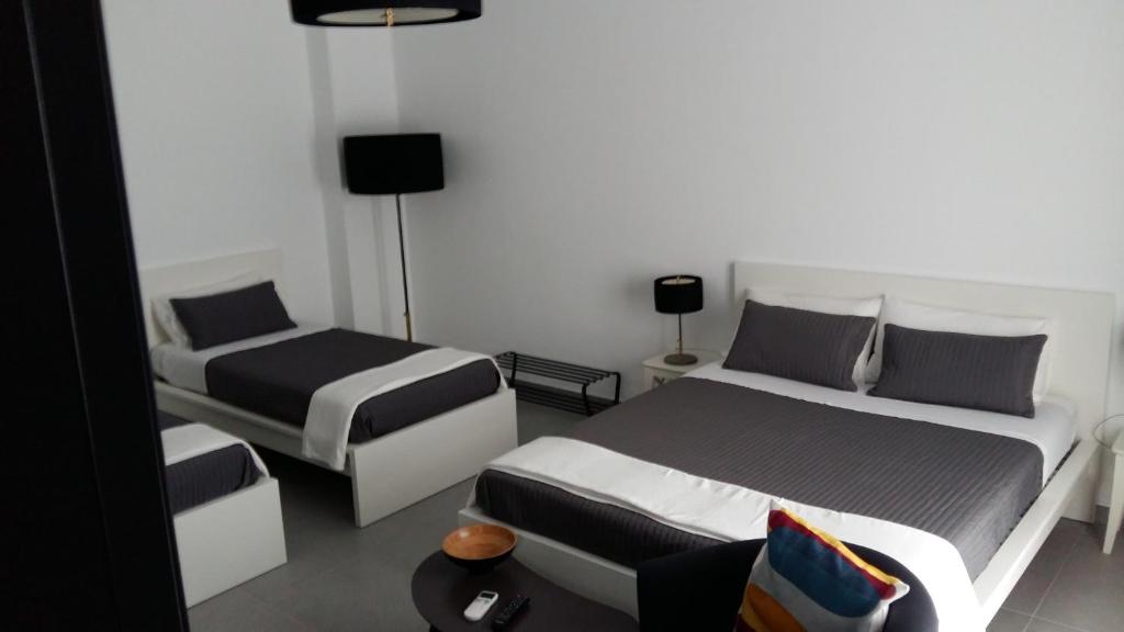 A bed or beds in a room at B&B Roda Barocco