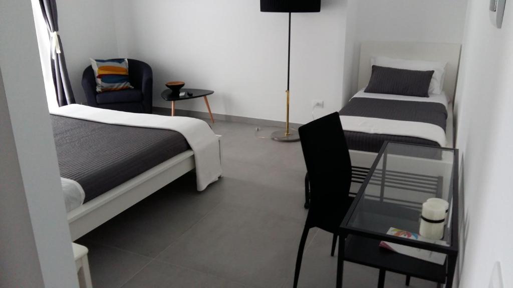 A bed or beds in a room at B&B Roda Barocco