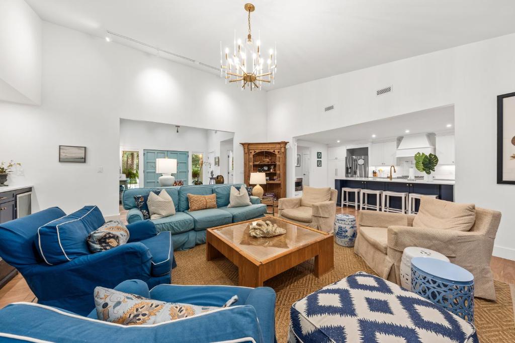 a living room with blue couches and a table at 2565 The Haul Over in Seabrook Island