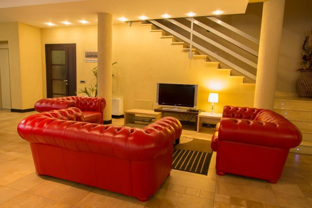 TV a/nebo společenská místnost v ubytování Albergo della Posta