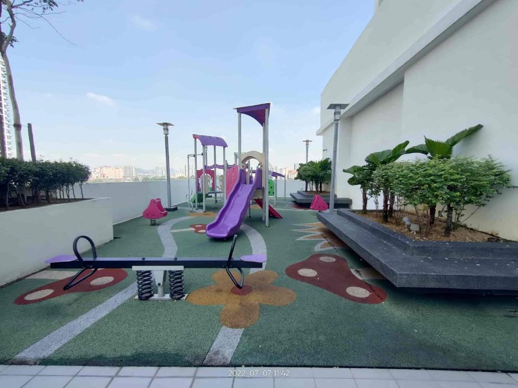 a playground on the roof of a building at Apartment One Maxim in Kuala Lumpur
