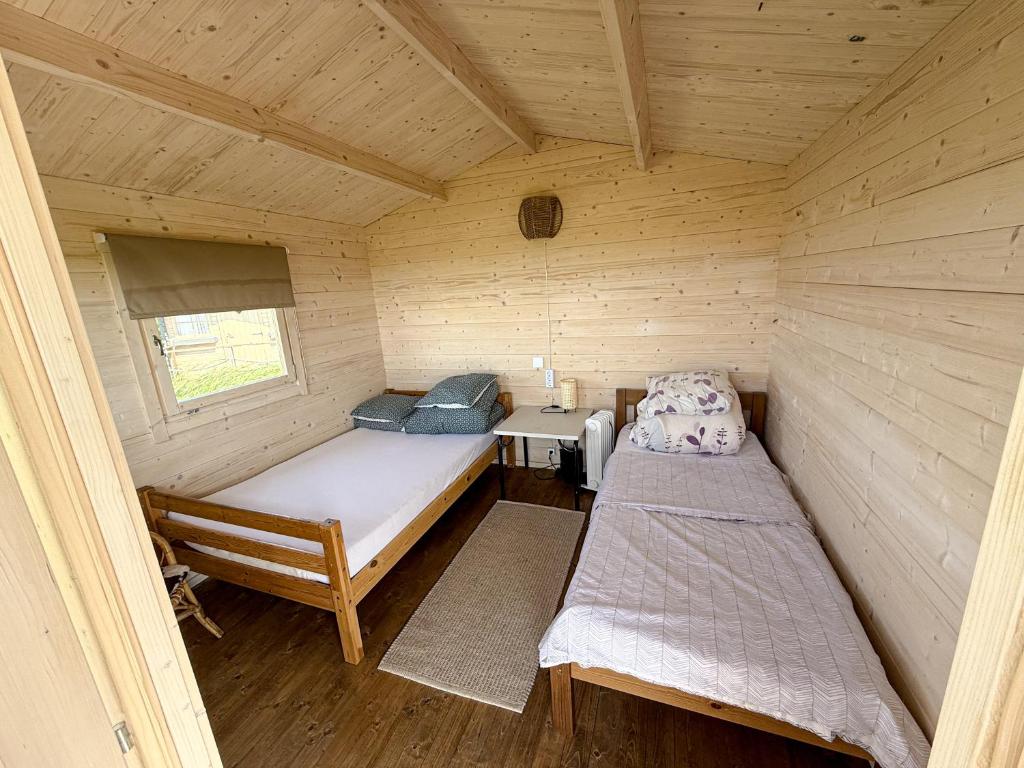 Postel nebo postele na pokoji v ubytování Seaside Retreat with Hot tub,Sauna, Pool & BBQ