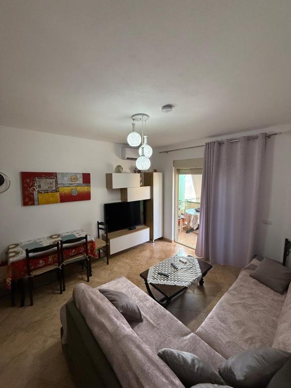 a living room with a couch and a table at Apartament 1+1 Golem in Golem