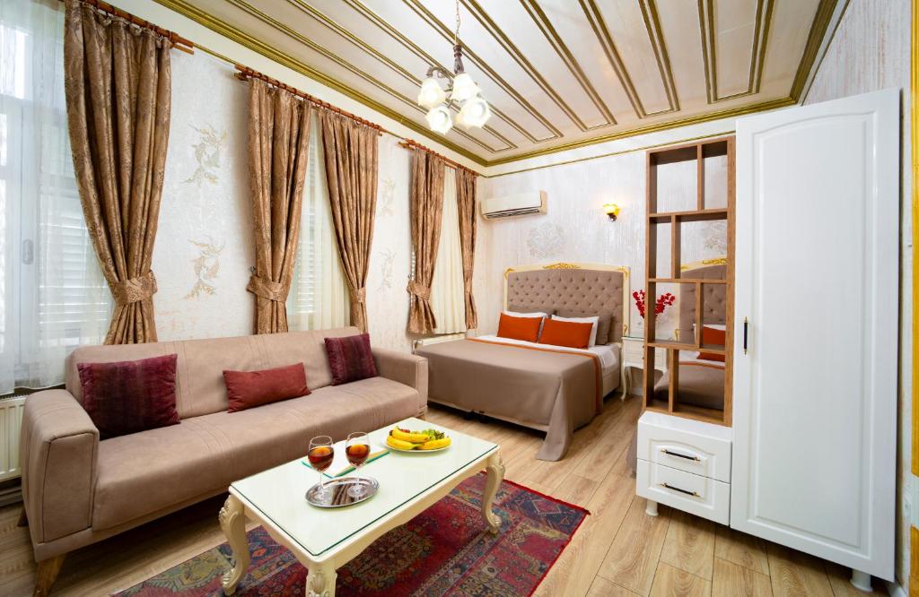 Postel nebo postele na pokoji v ubytování Alhambra Apart Hotel