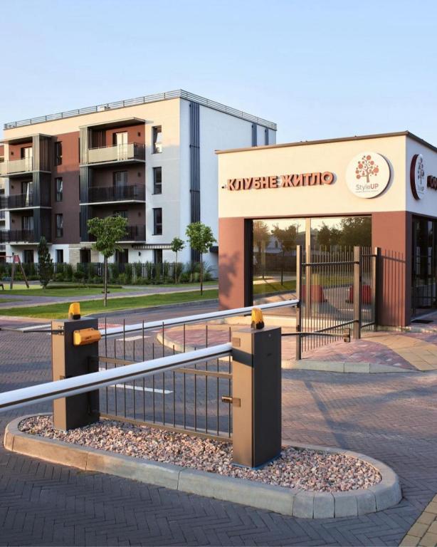 a building with a gate in front of a building at Apartament on StyleUp StayRent Lutsk in Lutsk