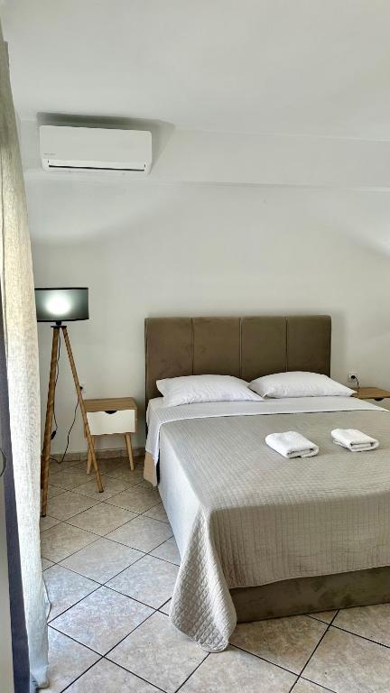 Postel nebo postele na pokoji v ubytování MaK Apartments