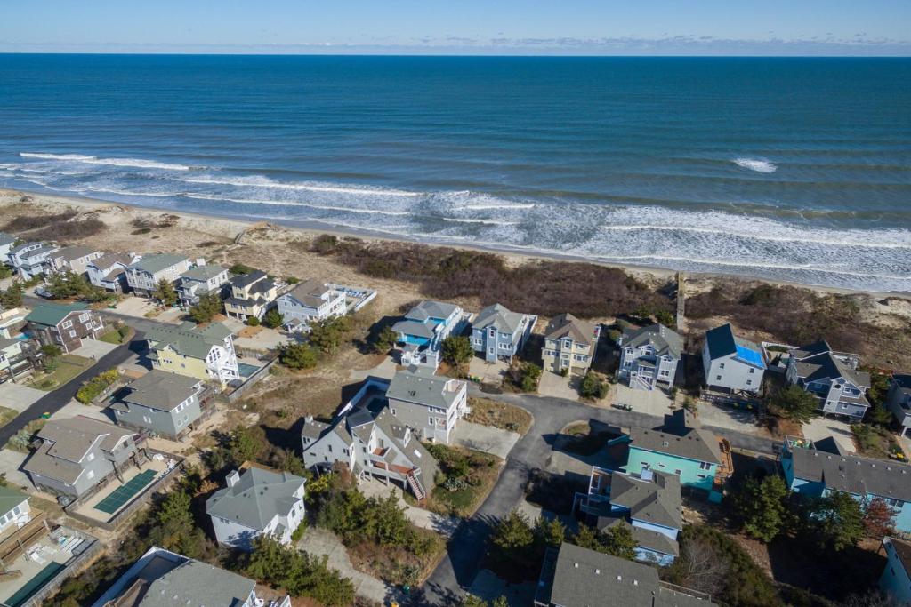 an aerial view of houses and the ocean at Fun2Sea in Corolla