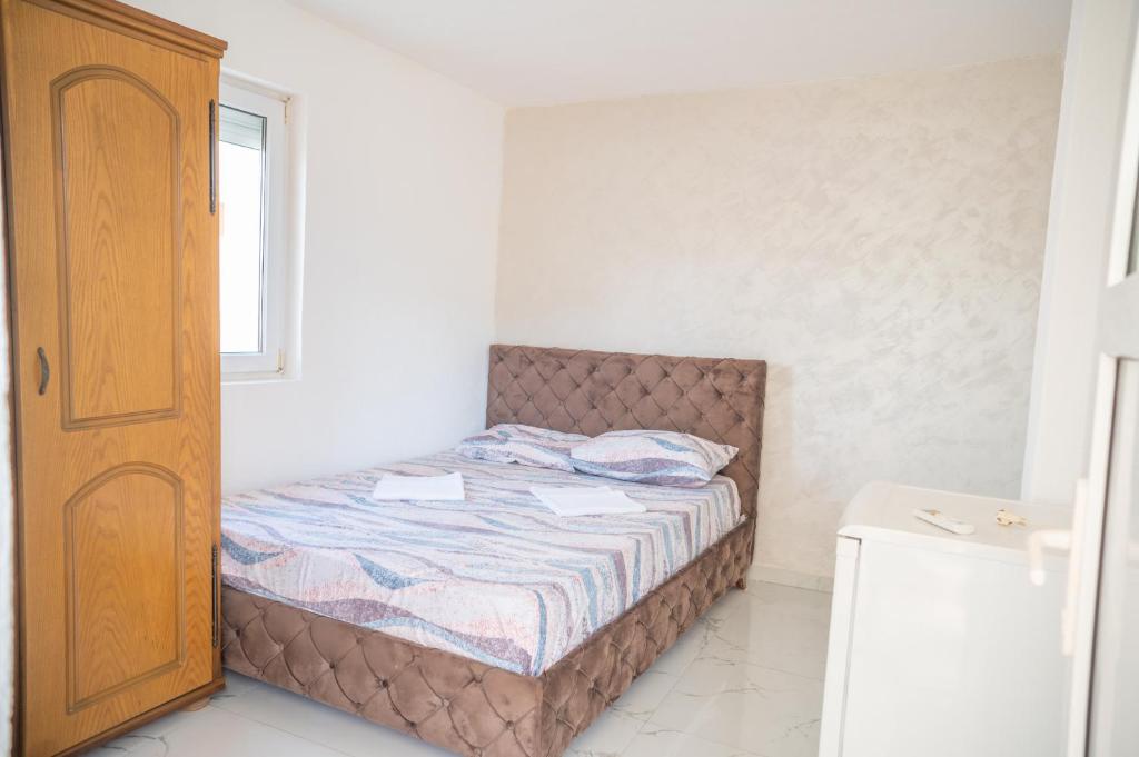 Postel nebo postele na pokoji v ubytování Apartmani Medovic
