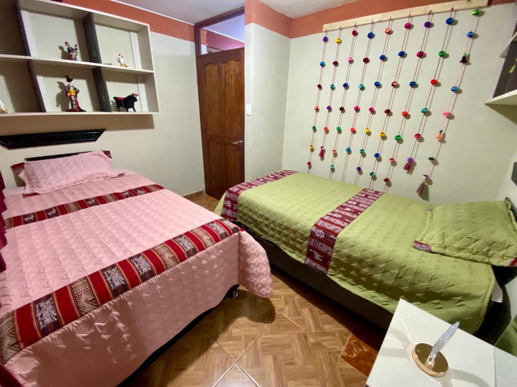 Postel nebo postele na pokoji v ubytování Nido Cusqueño