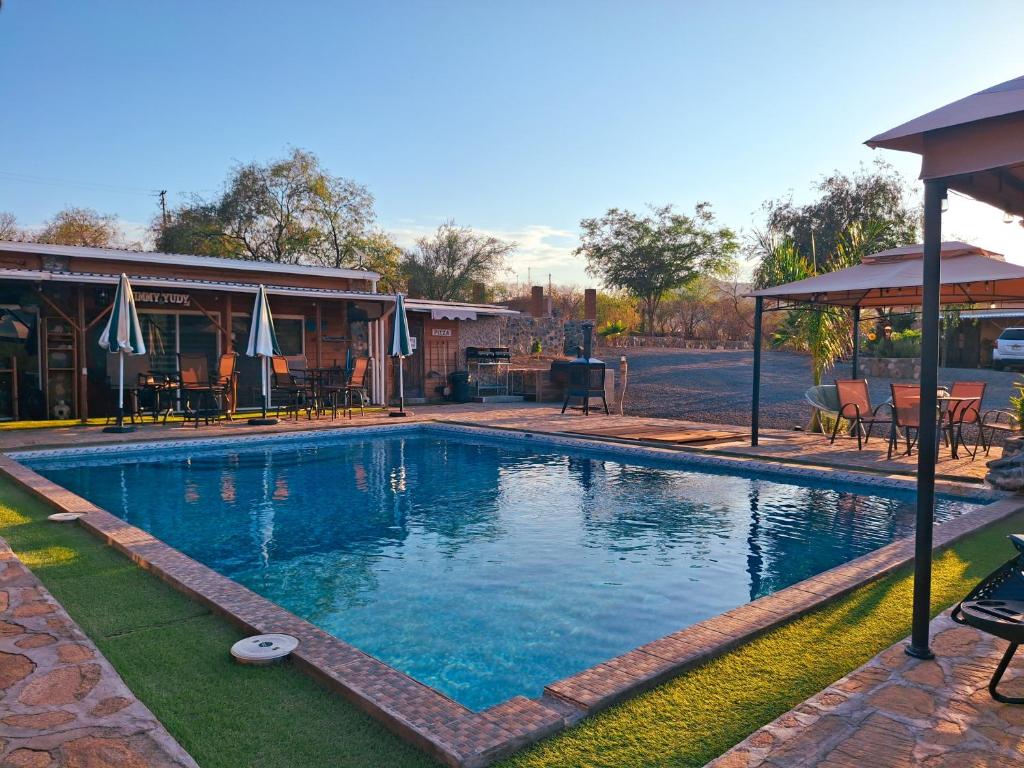 a large swimming pool in front of a building at Jimmy & Yudy's place in El Triunfo