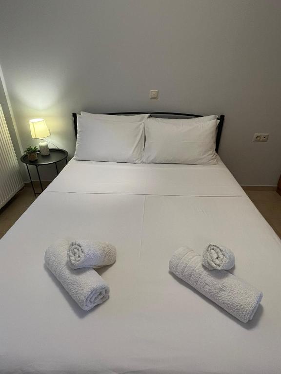 Postel nebo postele na pokoji v ubytování Bloom Garden Apartment
